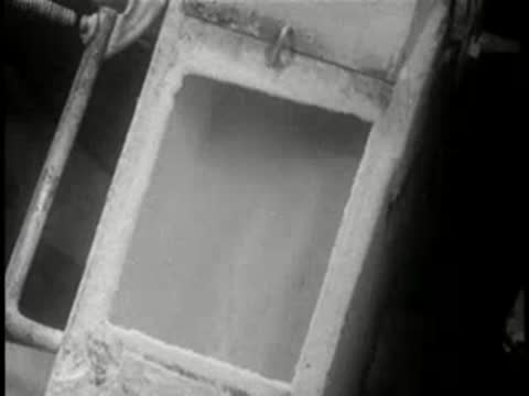 Close-up of an industrial processing tank inside a factory.