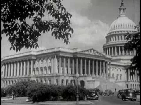 Exterior view of the United States Capitol building under a partly cloudy sky.
