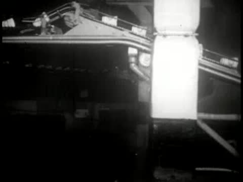 Conveyor systems transporting paper cups through a manufacturing plant.