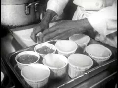 chef preparing individual paper cups for baking pies