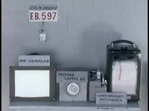 Air sampler and continuous recorder monitoring equipment on a lab table with text labels