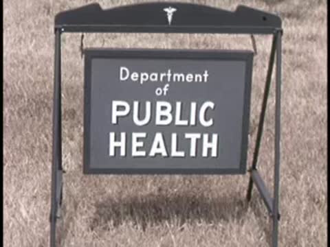 sign reading Department of Public Health planted in the grass