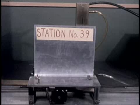 A small metal platform in a laboratory labeled "STATION No. 39".