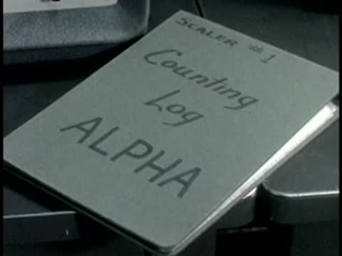 A Counting Log Alpha binder sits on a desk in a laboratory.