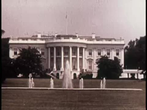 the white house in washington dc with a large lawn and water fountain in front